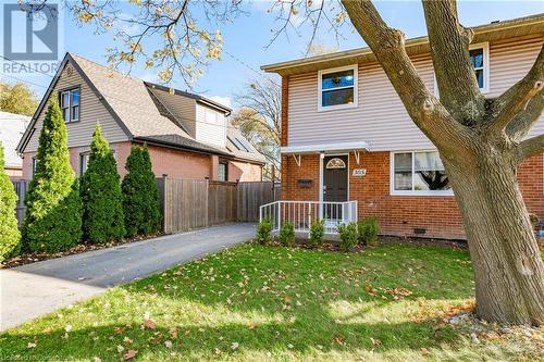 View of front facade with a front lawn - 305 East 24Th Street, Hamilton, ON - Outdoor