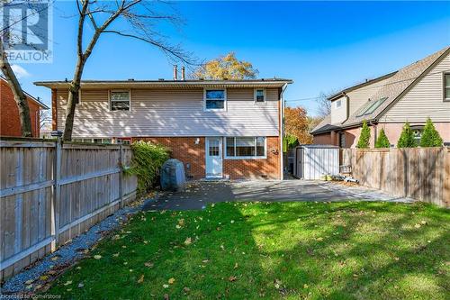 Back of house featuring a patio area and a lawn - 305 East 24Th Street, Hamilton, ON - Outdoor