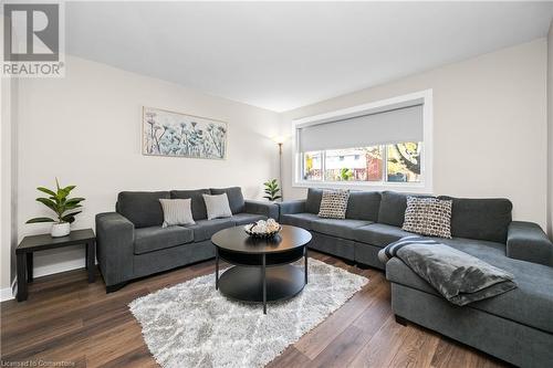 Living room with dark hardwood / wood-style floors - 305 East 24Th Street, Hamilton, ON - Indoor Photo Showing Living Room