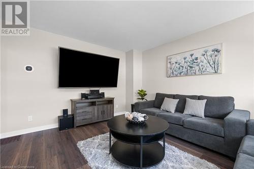 Living room with dark wood-type flooring - 305 East 24Th Street, Hamilton, ON - Indoor Photo Showing Living Room