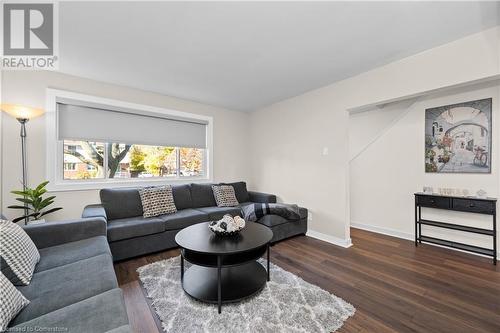 Living room with dark hardwood / wood-style flooring - 305 East 24Th Street, Hamilton, ON - Indoor Photo Showing Living Room