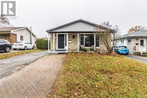 Bungalow-style house with a front lawn and covered porch - 39 Keewatin Avenue, Kitchener, ON - Outdoor