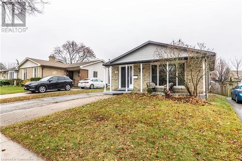 View of front of home featuring covered porch and a front lawn - 39 Keewatin Avenue, Kitchener, ON - Outdoor