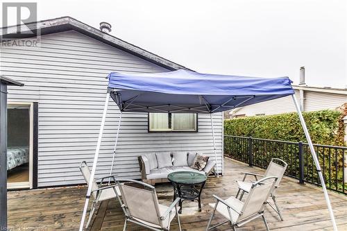 Wooden terrace featuring an outdoor living space - 39 Keewatin Avenue, Kitchener, ON - Outdoor With Deck Patio Veranda With Exterior