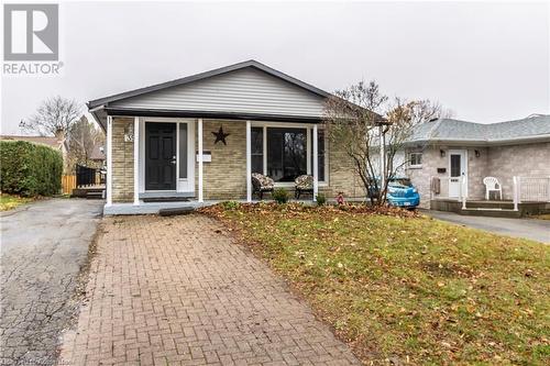 Bungalow featuring a front lawn and a porch - 39 Keewatin Avenue, Kitchener, ON - Outdoor With Facade