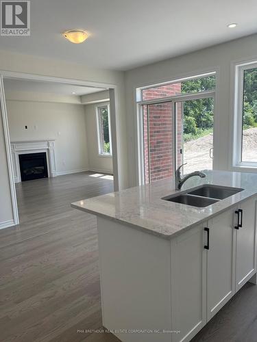 6 Forestlane Way, Scugog, ON - Indoor Photo Showing Kitchen With Fireplace With Double Sink