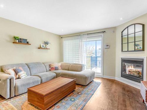 Salon - 3469 Boul. St-Elzear O., Laval (Chomedey), QC - Indoor Photo Showing Living Room With Fireplace