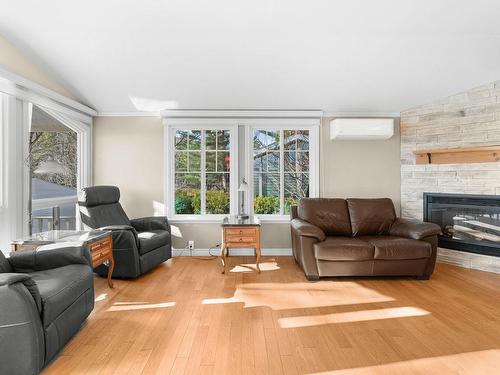 Living room - 203-2141 Rg De La Rivière, Saint-Isidore, QC - Indoor Photo Showing Living Room With Fireplace