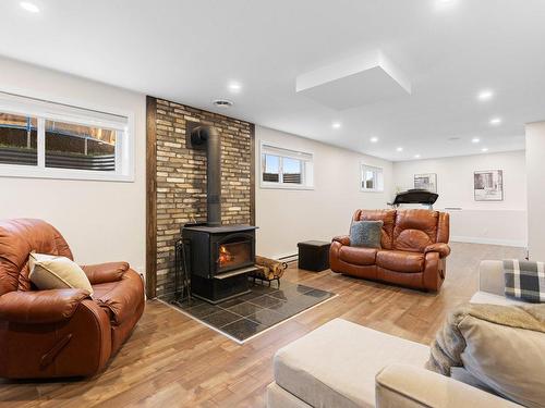 Family room - 253 Rue Griffin, Shannon, QC - Indoor With Fireplace