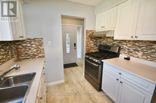 Kitchen view of front door - 1800 Attawandaron Road, London, ON - Indoor Photo Showing Kitchen With Double Sink