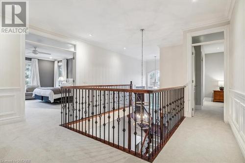 Hall featuring ornamental molding and light carpet - 1143 Riverbank Way, Oakville, ON 