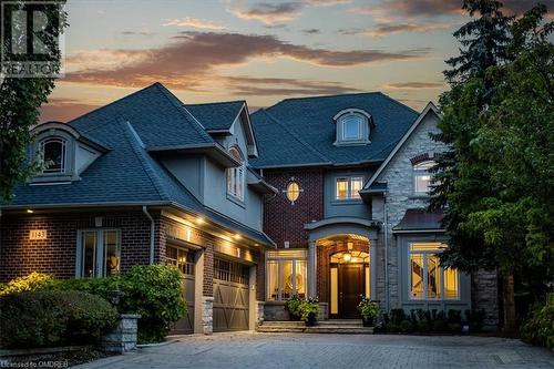 View of front facade with a garage - 1143 Riverbank Way, Oakville, ON 