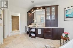 Bathroom with tile patterned flooring, vanity, and an enclosed shower - 