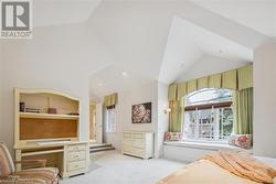 Carpeted bedroom featuring lofted ceiling - 