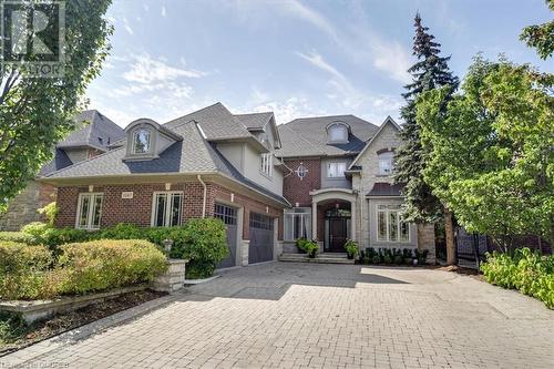 View of front of home featuring a garage - 1143 Riverbank Way, Oakville, ON 