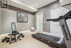 Workout room with carpet flooring - 