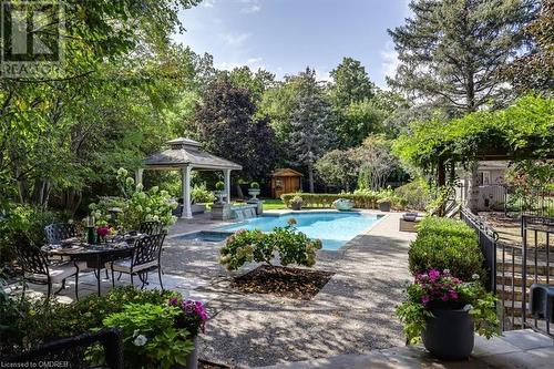 View of pool with a gazebo, a patio, and a storage shed - 1143 Riverbank Way, Oakville, ON 