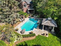 View of swimming pool featuring a gazebo and a patio - 