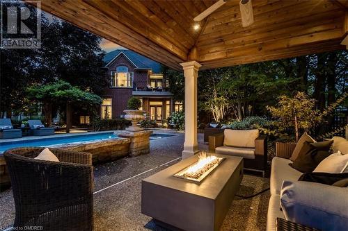 View of patio / terrace featuring an outdoor living space with a fire pit and ceiling fan - 1143 Riverbank Way, Oakville, ON 