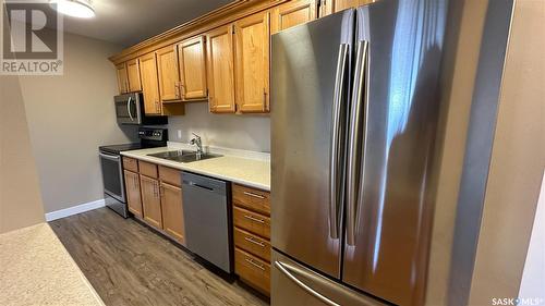 208 4045 Rae Street, Regina, SK - Indoor Photo Showing Kitchen With Stainless Steel Kitchen With Double Sink