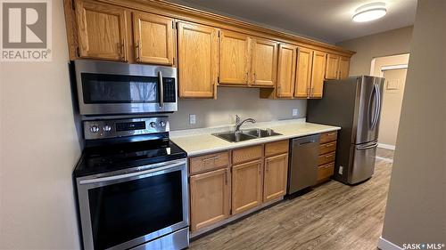 208 4045 Rae Street, Regina, SK - Indoor Photo Showing Kitchen With Stainless Steel Kitchen With Double Sink