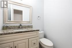 Bathroom featuring vanity and toilet - 