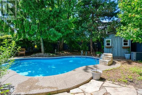 View of swimming pool with an outdoor structure - 146 Kitty Murray Lane, Ancaster, ON - Outdoor With In Ground Pool