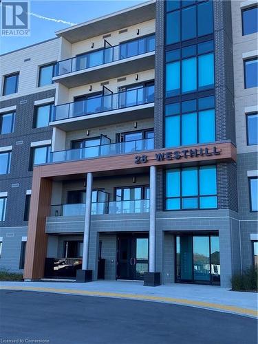 View of building exterior - 28 Westhill Drive Unit# 206, Waterloo, ON - Outdoor With Balcony With Facade