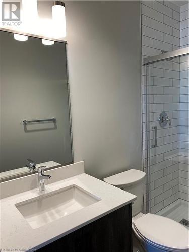 Bathroom featuring vanity, toilet, and a shower with door - 28 Westhill Drive Unit# 206, Waterloo, ON - Indoor Photo Showing Bathroom