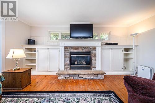 24 Mcrae Beach Road S, Georgina, ON - Indoor Photo Showing Living Room With Fireplace