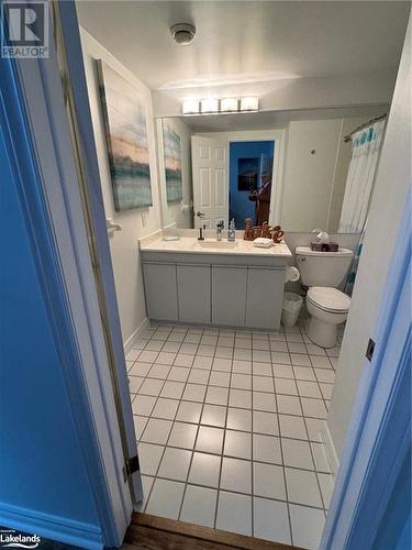 Bathroom featuring tile patterned flooring, vanity, and toilet - 231 Grandview/Hilltop Drive, Huntsville, ON - Indoor Photo Showing Bathroom