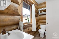 Main floor 3-pc bathroom has shower and cheater door to second bedroom - 