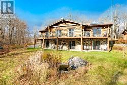 Scandinavin-style log home with 5 bedrooms, 4 with ensuites and walkouts. - 