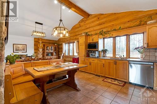 Kitchen with bench-seated breakfast nook - 921 Norwood Road, Westport, ON - Indoor Photo Showing Kitchen