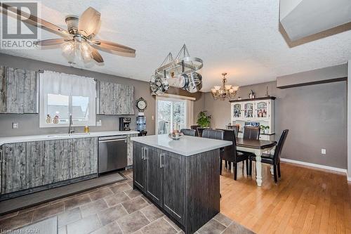 Kitchen with sink, dishwasher, a center island, light hardwood / wood-style flooring, and pendant lighting - 727 Zermatt Drive, Waterloo, ON - Indoor