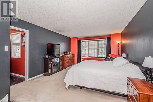 Carpeted bedroom featuring a textured ceiling - 727 Zermatt Drive, Waterloo, ON - Indoor Photo Showing Bedroom