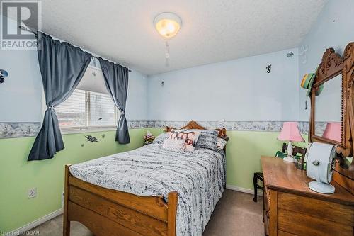 Bedroom featuring carpet floors and a textured ceiling - 727 Zermatt Drive, Waterloo, ON - Indoor Photo Showing Bedroom