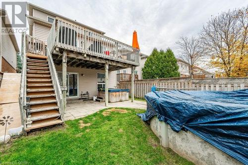 Rear view of property with a patio area, a deck, a yard, and a hot tub - 727 Zermatt Drive, Waterloo, ON - Outdoor With Deck Patio Veranda