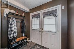 Mudroom with a textured ceiling - 