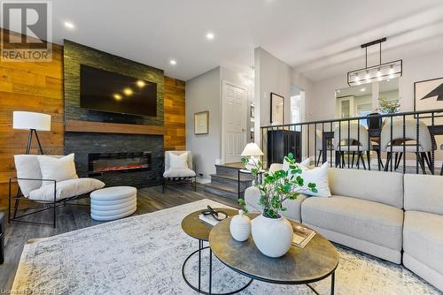 2050 Upper Middle Road Unit# 179, Burlington, ON - Indoor Photo Showing Living Room With Fireplace