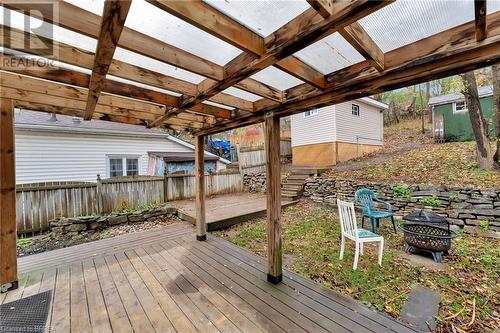 Wooden terrace featuring a fire pit - 59 Buffalo Street, Brantford, ON - Outdoor With Exterior