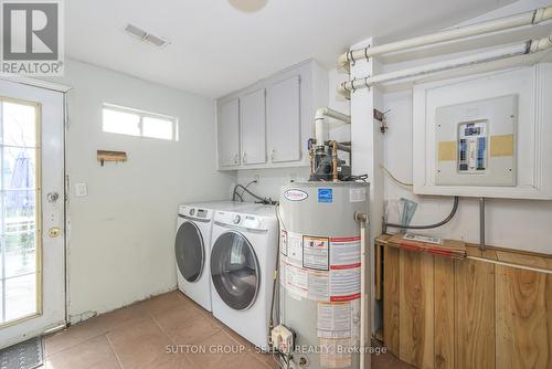 Utility room/laundry, access to backyard - 22919 Hagerty Road, Newbury, ON - Indoor Photo Showing Laundry Room