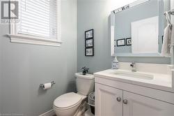 Bathroom featuring vanity and toilet - 