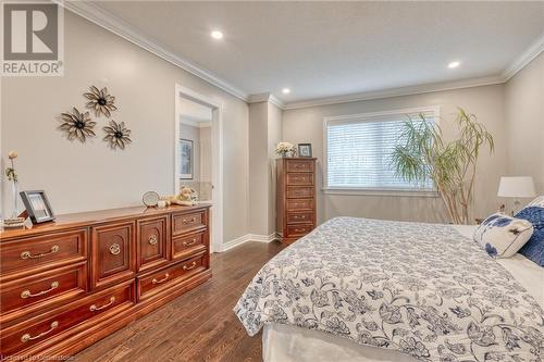 Bedroom with ornamental molding and dark wood-type flooring - 26 Summerberry Way, Hamilton, ON - Indoor Photo Showing Bedroom