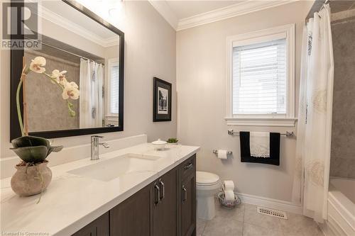 Full bathroom featuring vanity, shower / bath combo, crown molding, tile patterned flooring, and toilet - 26 Summerberry Way, Hamilton, ON - Indoor Photo Showing Bathroom