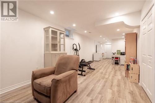 Exercise room with light wood-type flooring and washer / clothes dryer - 26 Summerberry Way, Hamilton, ON - Indoor