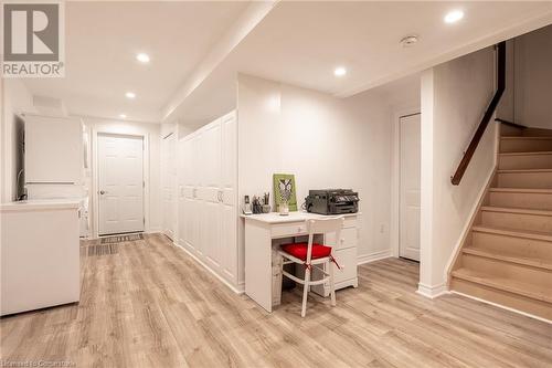 Bar with white cabinetry and light hardwood / wood-style floors - 26 Summerberry Way, Hamilton, ON - Indoor Photo Showing Other Room