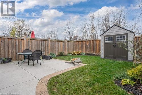 View of yard with a patio area and a storage unit - 26 Summerberry Way, Hamilton, ON - Outdoor