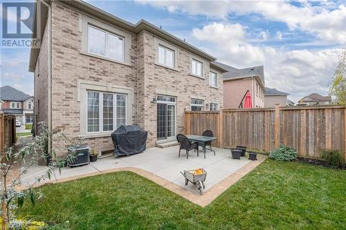 Rear view of house featuring a yard and a patio - 26 Summerberry Way, Hamilton, ON - Outdoor