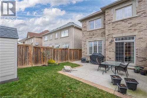 Back of house featuring a lawn and a patio - 26 Summerberry Way, Hamilton, ON - Outdoor With Exterior